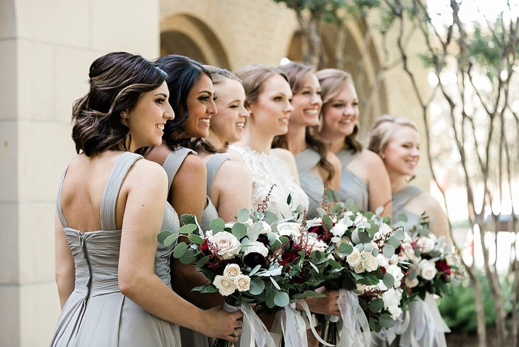 bridal party with flowers West University Baptist Church, TX