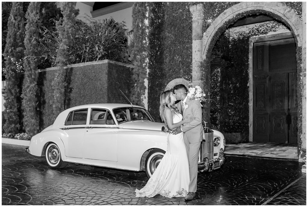 wedding kiss pose with classic car