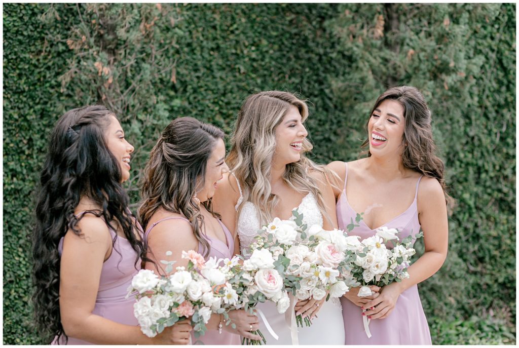 bride and bridesmaids in pink dresses