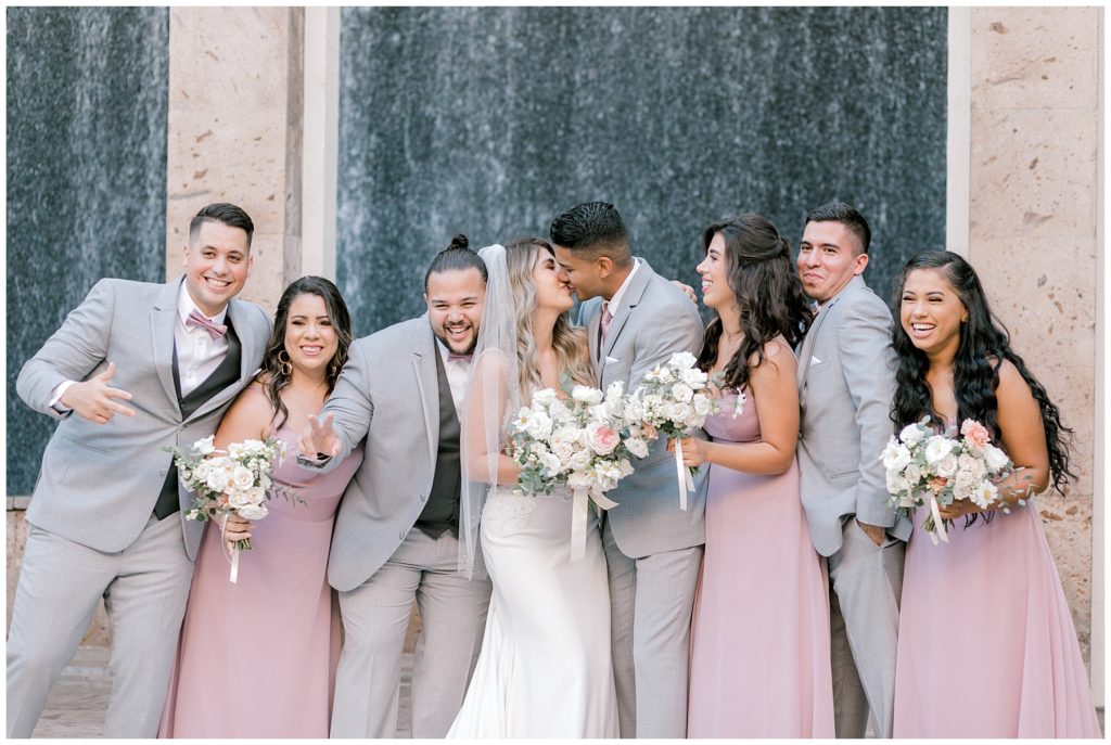 fun pose with bridal party